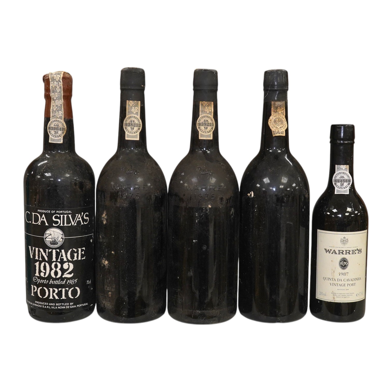 Five bottles of port to include three bottles of Warre’s 1975 (no label), a bottle of C. Da Silvas Vintage 1982 port and a 37.5cl bottle of Warres 1987 Quinta Da Cavadinha. Condition - fair to good, three bottles without